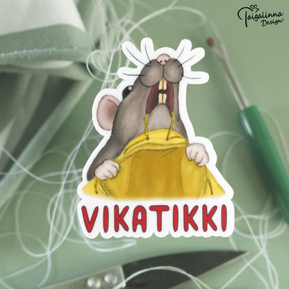 Taigalinnan  neule ja ompeluaiheiset tarrat.